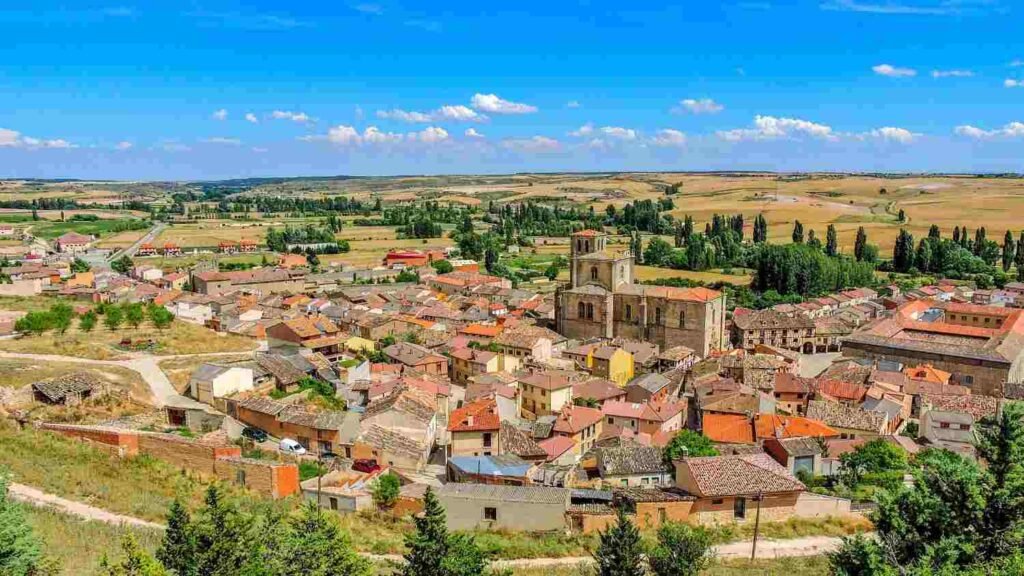 Panoramic view of a historic Portuguese village with terracotta rooftops and a church