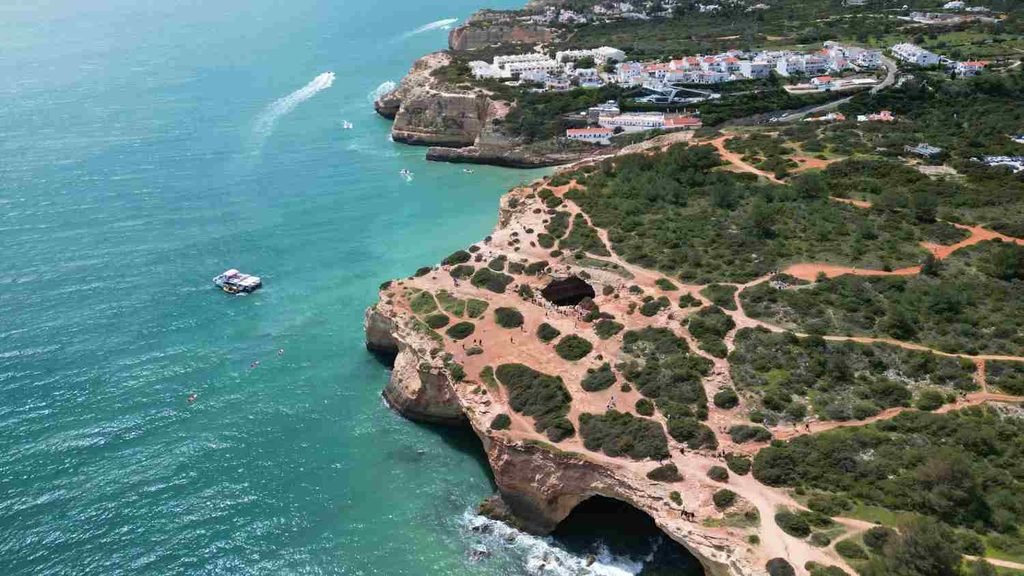 Sandy cove and limestone cliffs near Benagil beach in the Algarve, Portugal