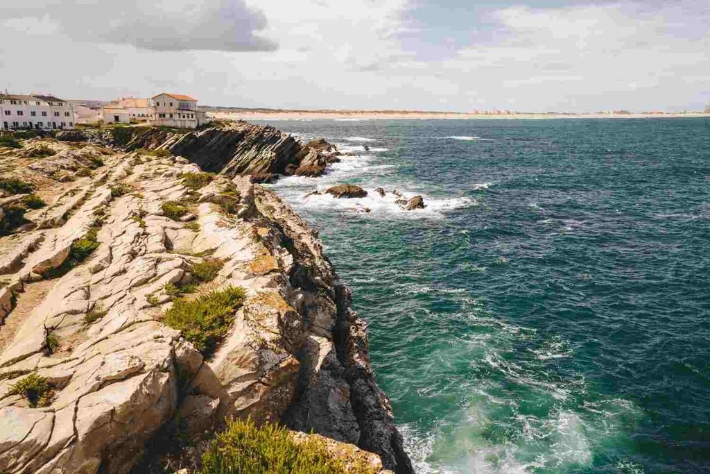 Rocky coastal shoreline and blue Atlantic waters near Peniche, Portugal